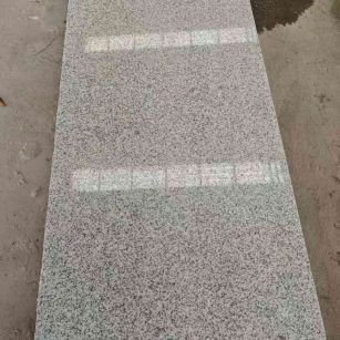 日喀则布芝麻白光面毛板